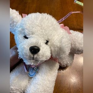 Poochie and Co.‎ dog purse. White with a sparkly pink outfit.